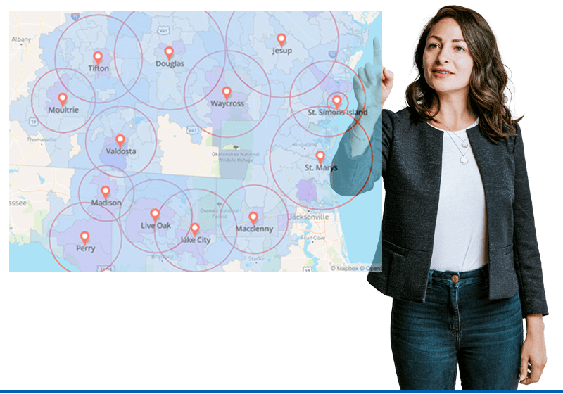 Marketing professional pointing to a radius-targeting map covering Georgia and Florida cities